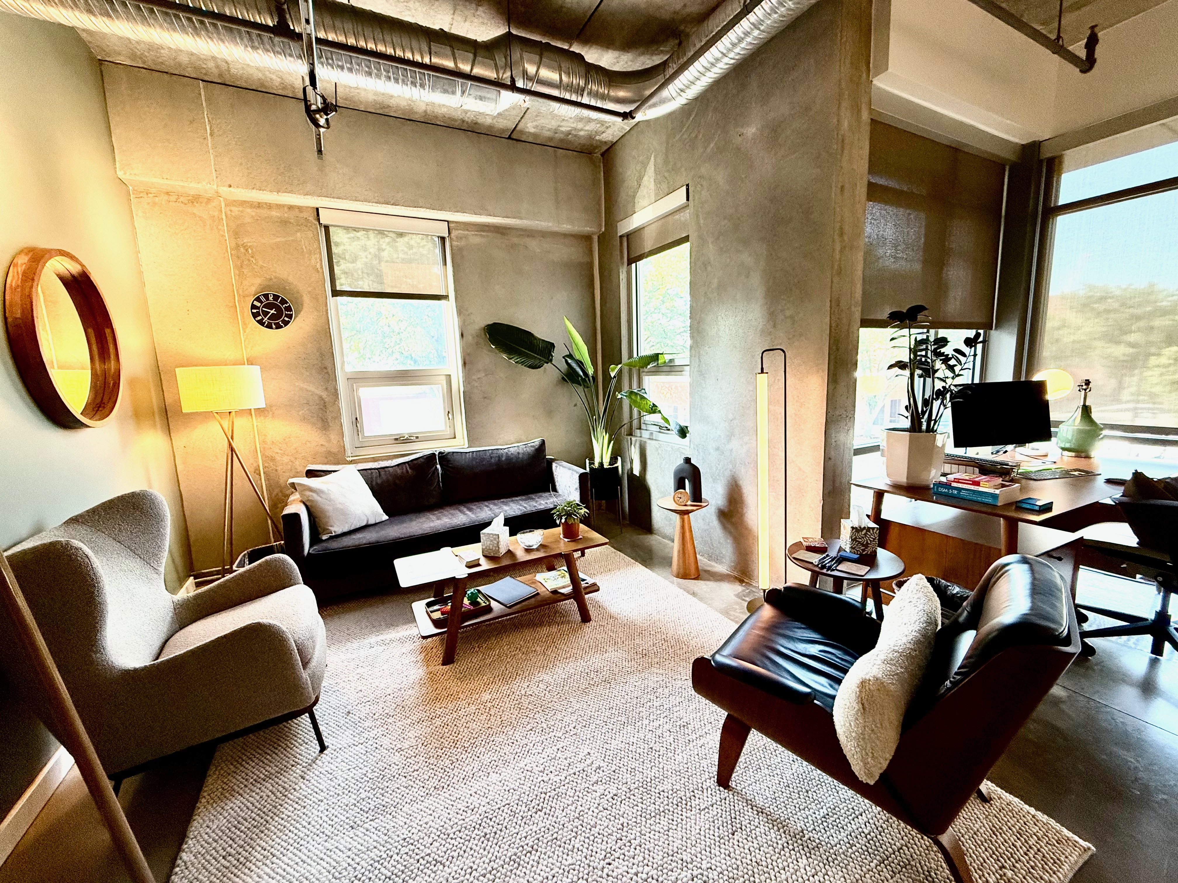 Seva therapy office with comfortable seating, plants, and natural light.